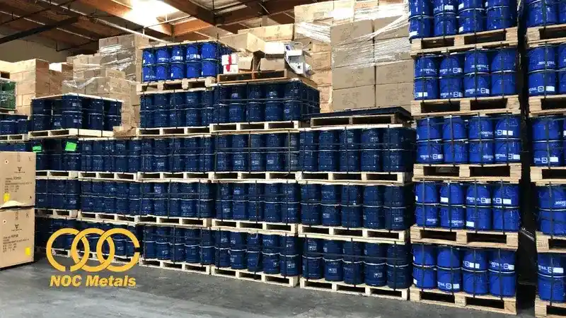 Bulk WC powder USA warehouse - hundreds of tungsten carbide drums stacked on pallets